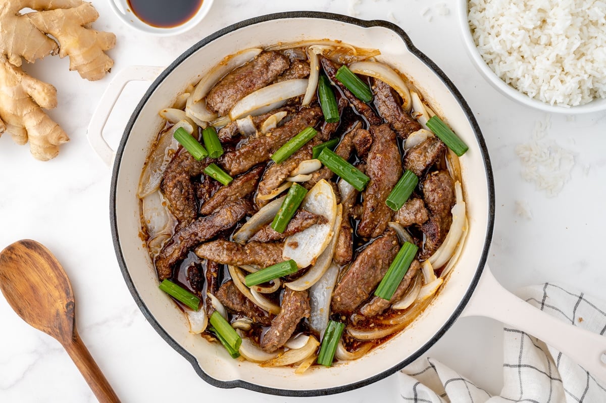 stir fry beef cooking in a pan