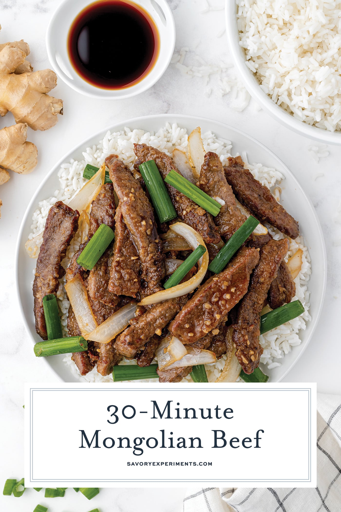 overhead shot of mongolian beef on a plate with text overlay for pinterest