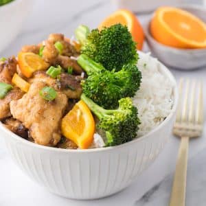 orange chicken with broccoli and rice