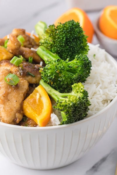 orange chicken with broccoli and rice