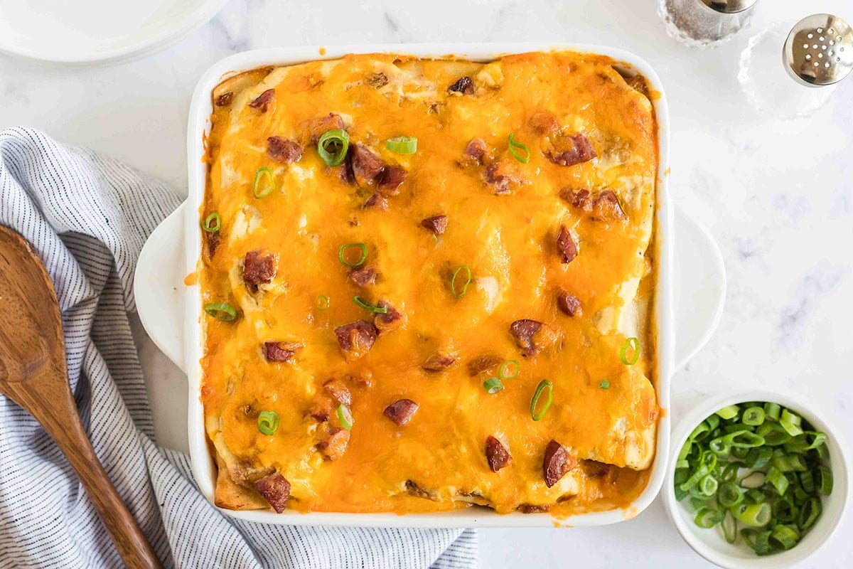 pierogi casserole topped with scallions