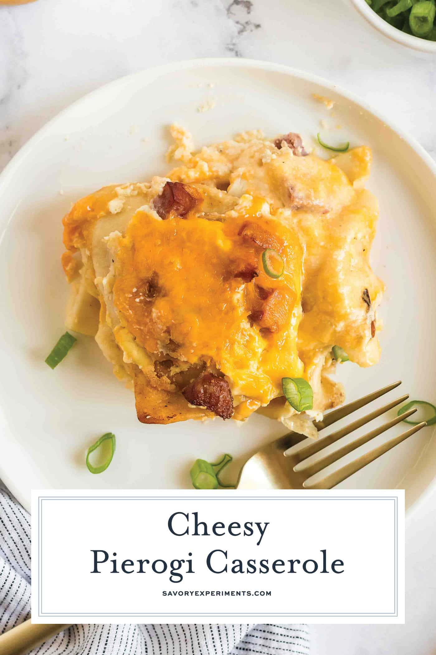 slice of cheesy casserole on plate with text overlay for pinterest