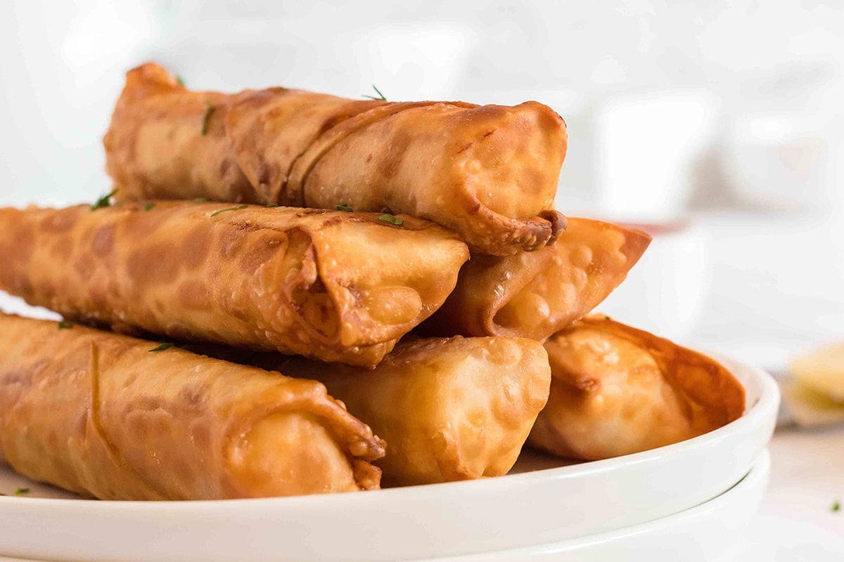 stack of pizza egg rolls on plate