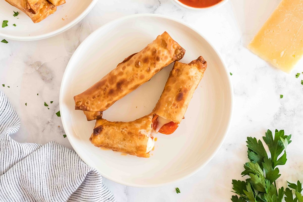 overhead shot of two pizza logs on a plate