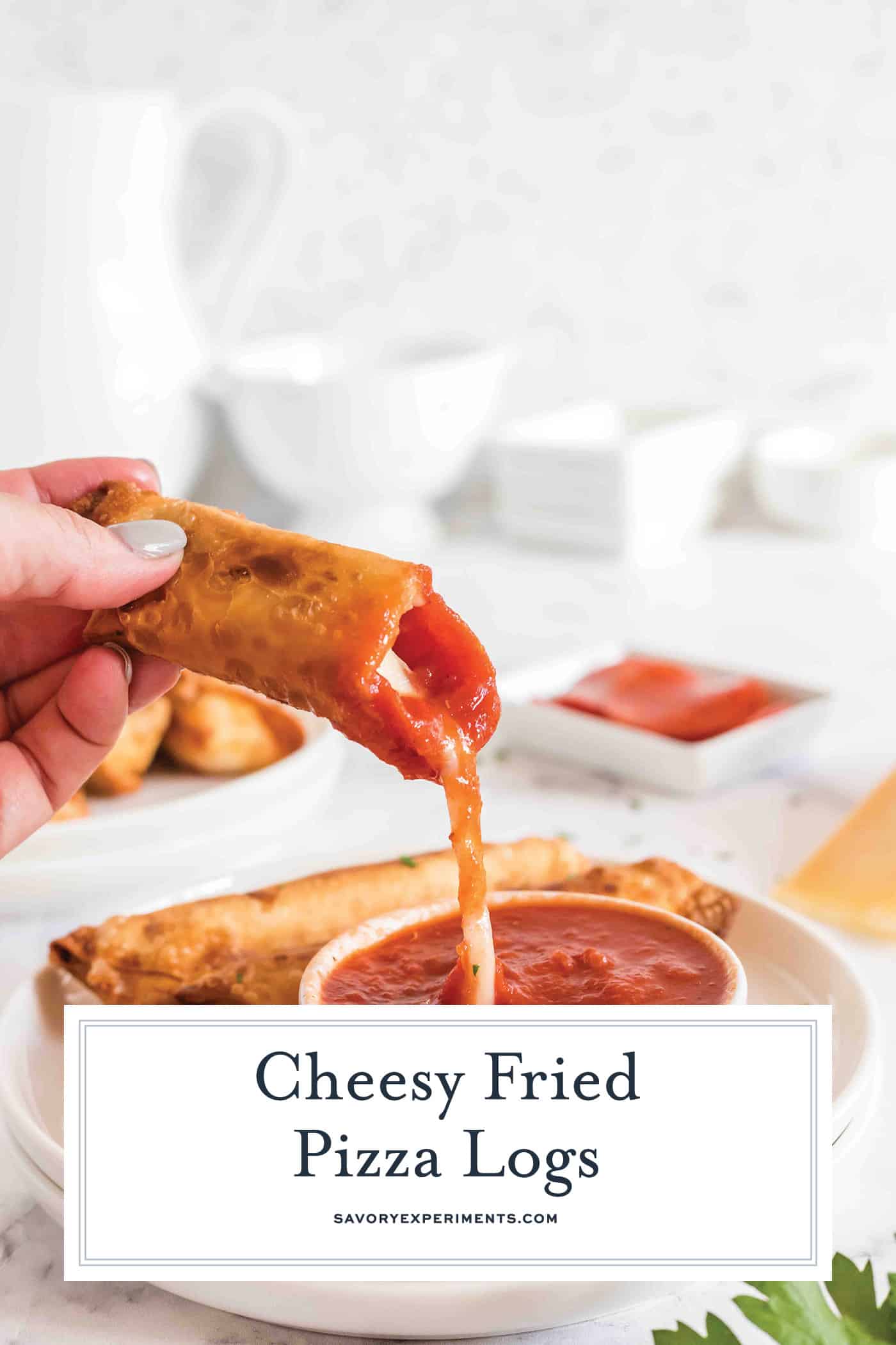 pizza log dipped into sauce with text overlay for pinterest