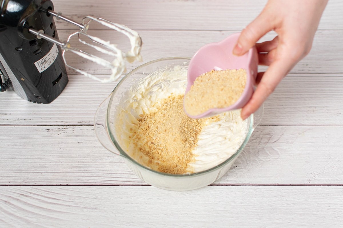 graham cracker crumbs poured into cheesecake mixture