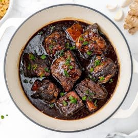 overhead shot of honey ginger short ribs in dutch oven