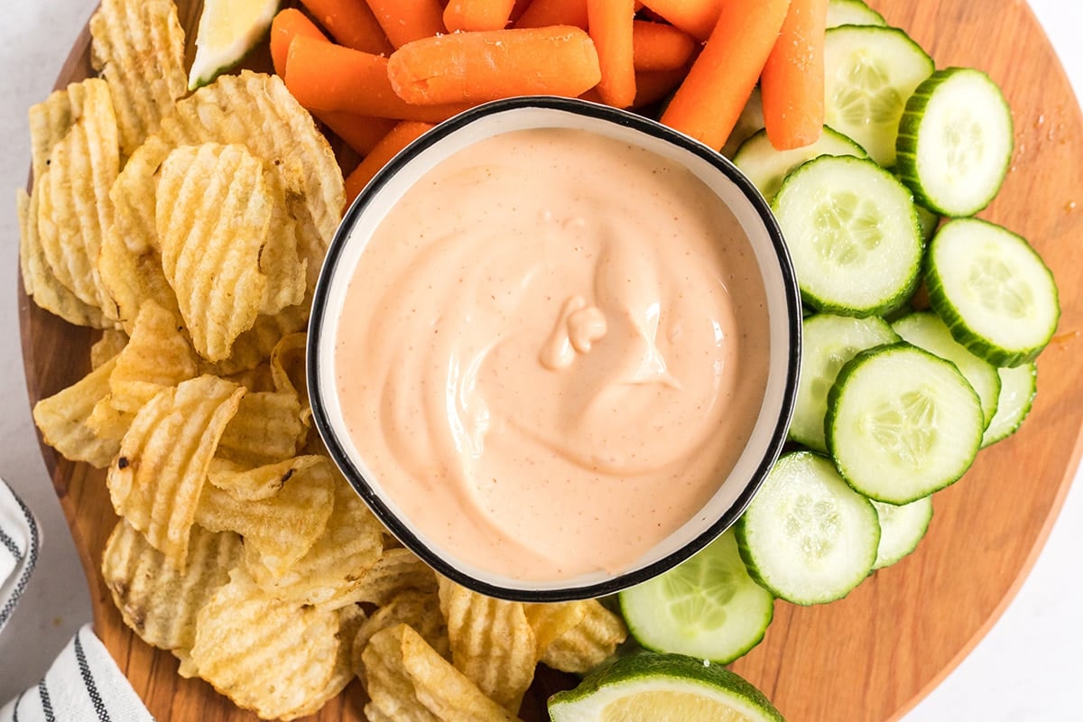 overhead shot of spicy aioli in bowl with veggies