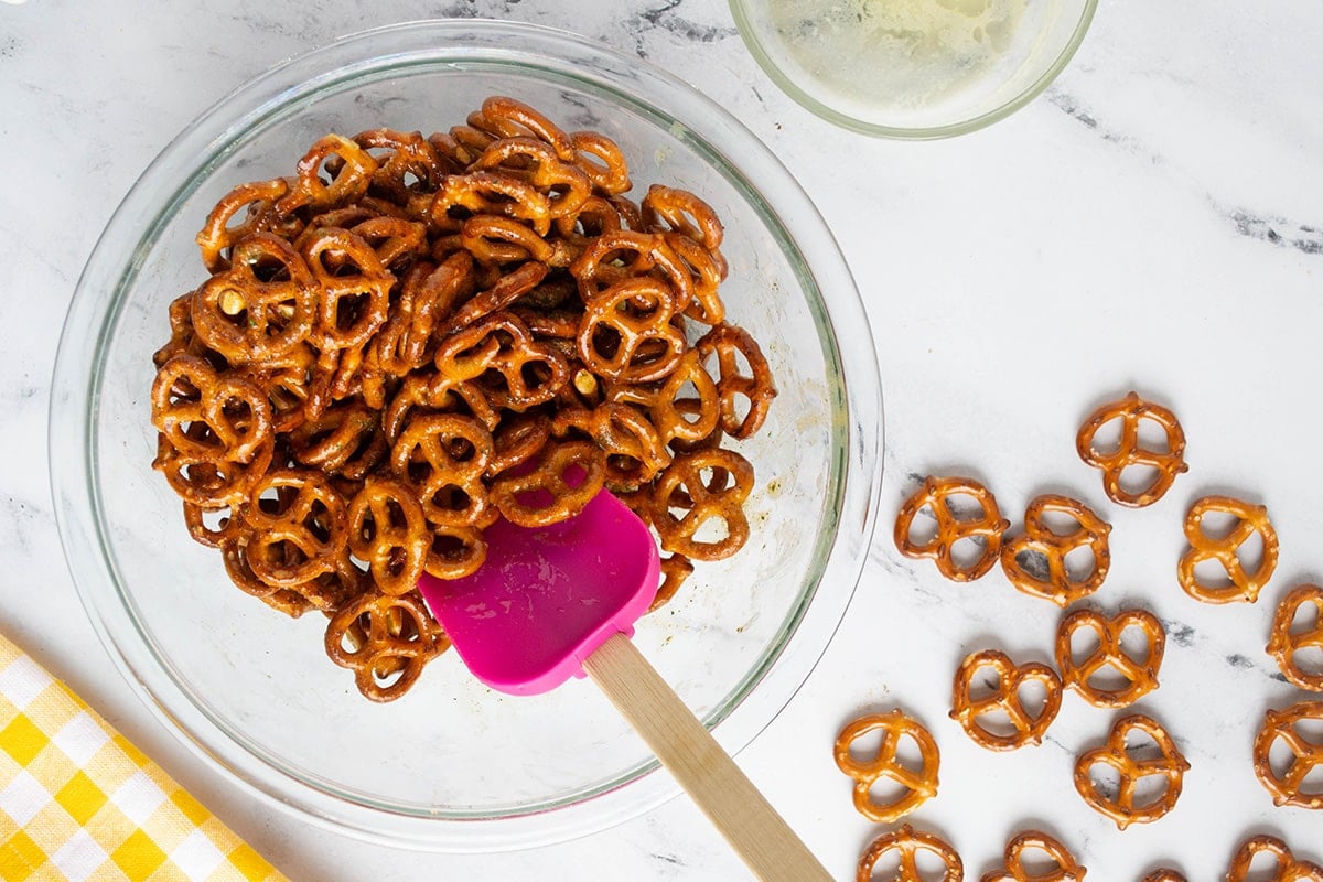 spatula stirring bowl of pretzels