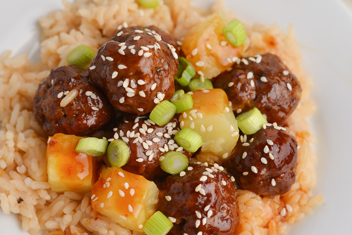 close up of meatballs over rice