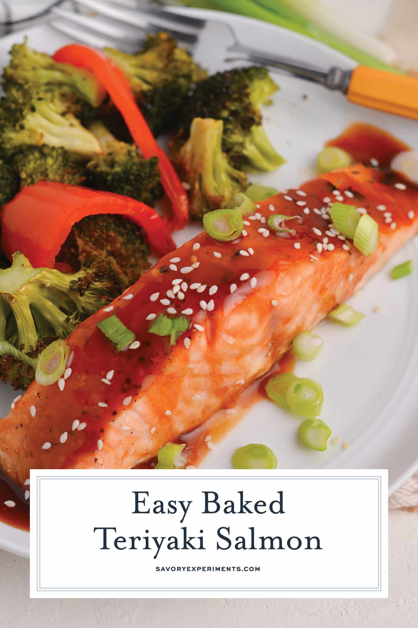 salmon on a plate with veggies with text overlay for pinterest