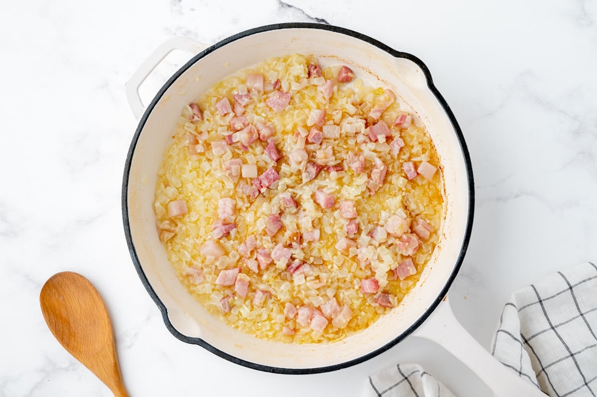 pork and onions cooking in a pan