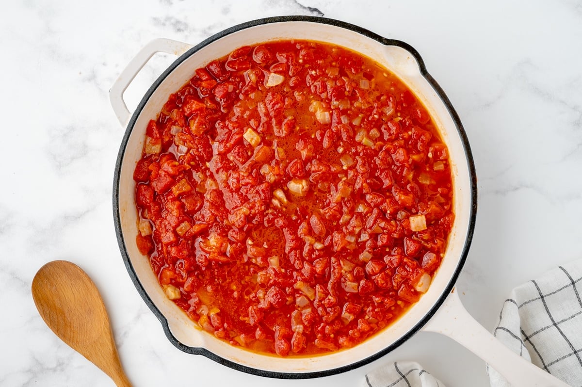 crushed tomatoes cooking in a pan