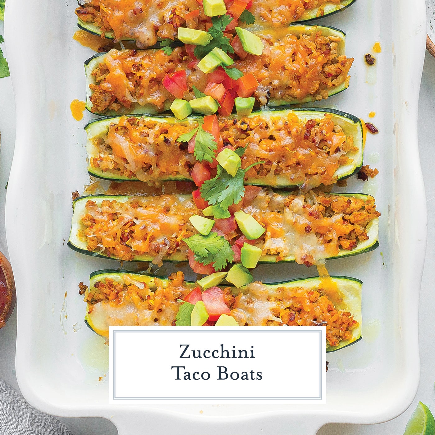 diagonal shot of taco zucchini boats with text overlay for facebook