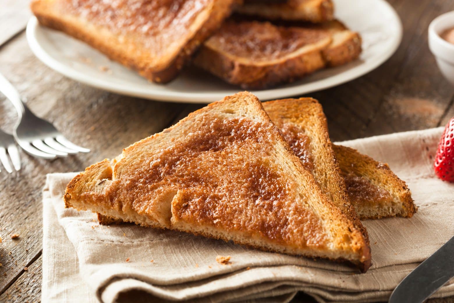 sliced cinnamon sugar toast on a linen