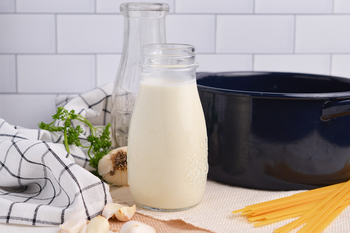 glass jar of creamy garlic alfredo sauce