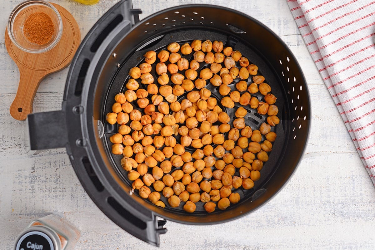 overhead shot of crispy chickpeas in air fryer basket
