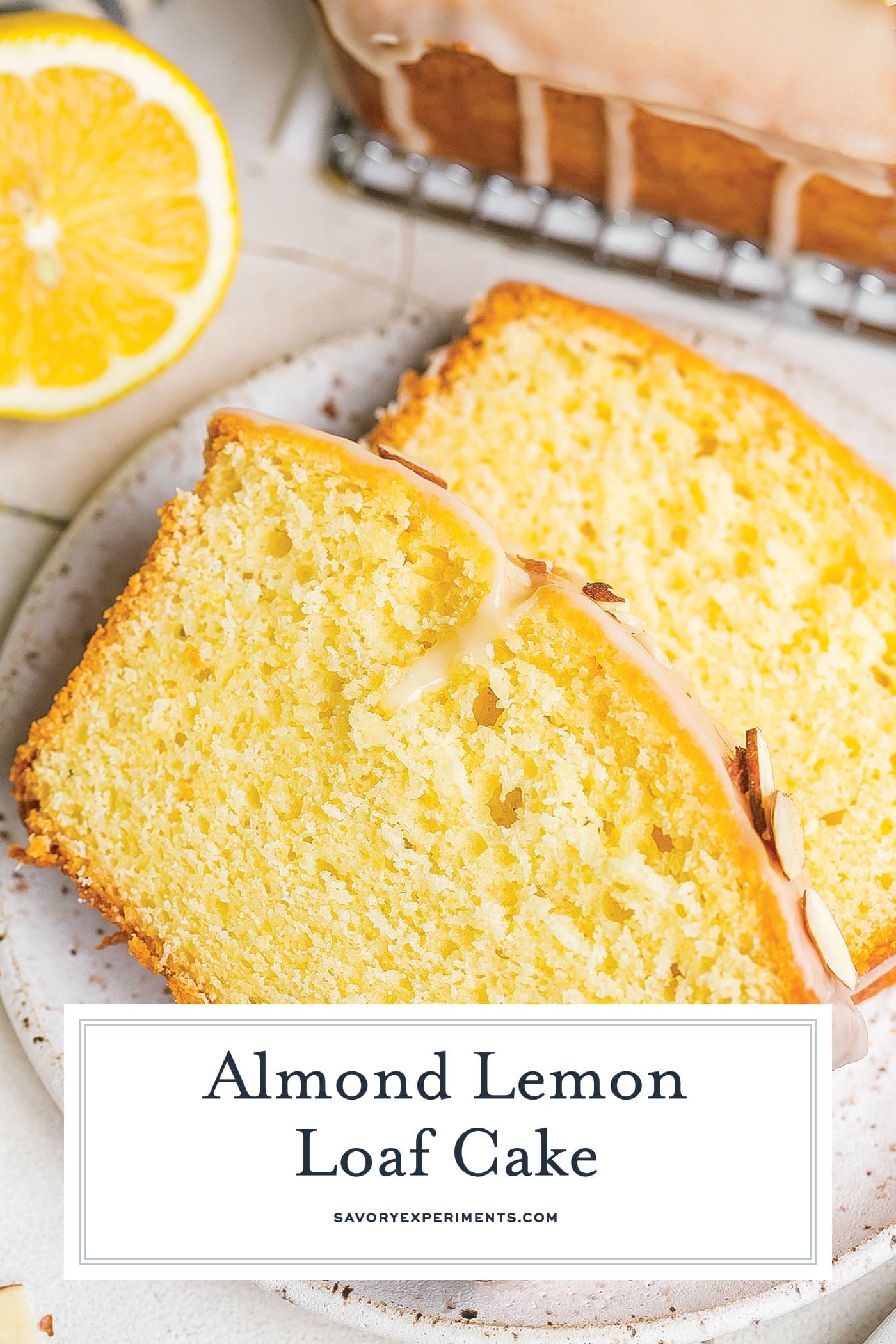 close up of two slices of lemon loaf cake on a plate with text overlay for pinterest
