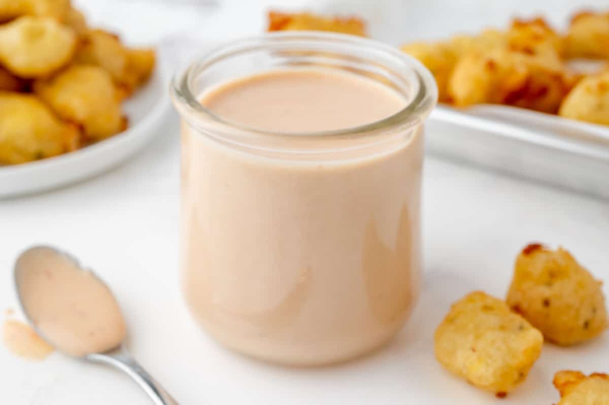 angled shot of bloomin onion sauce in jar