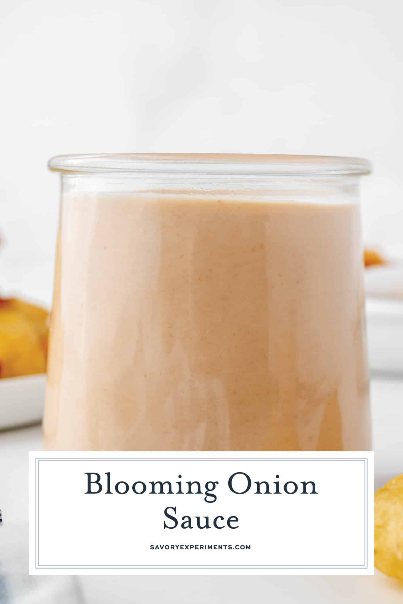 straight on shot of bloomin onion sauce with text overlay for pinterest
