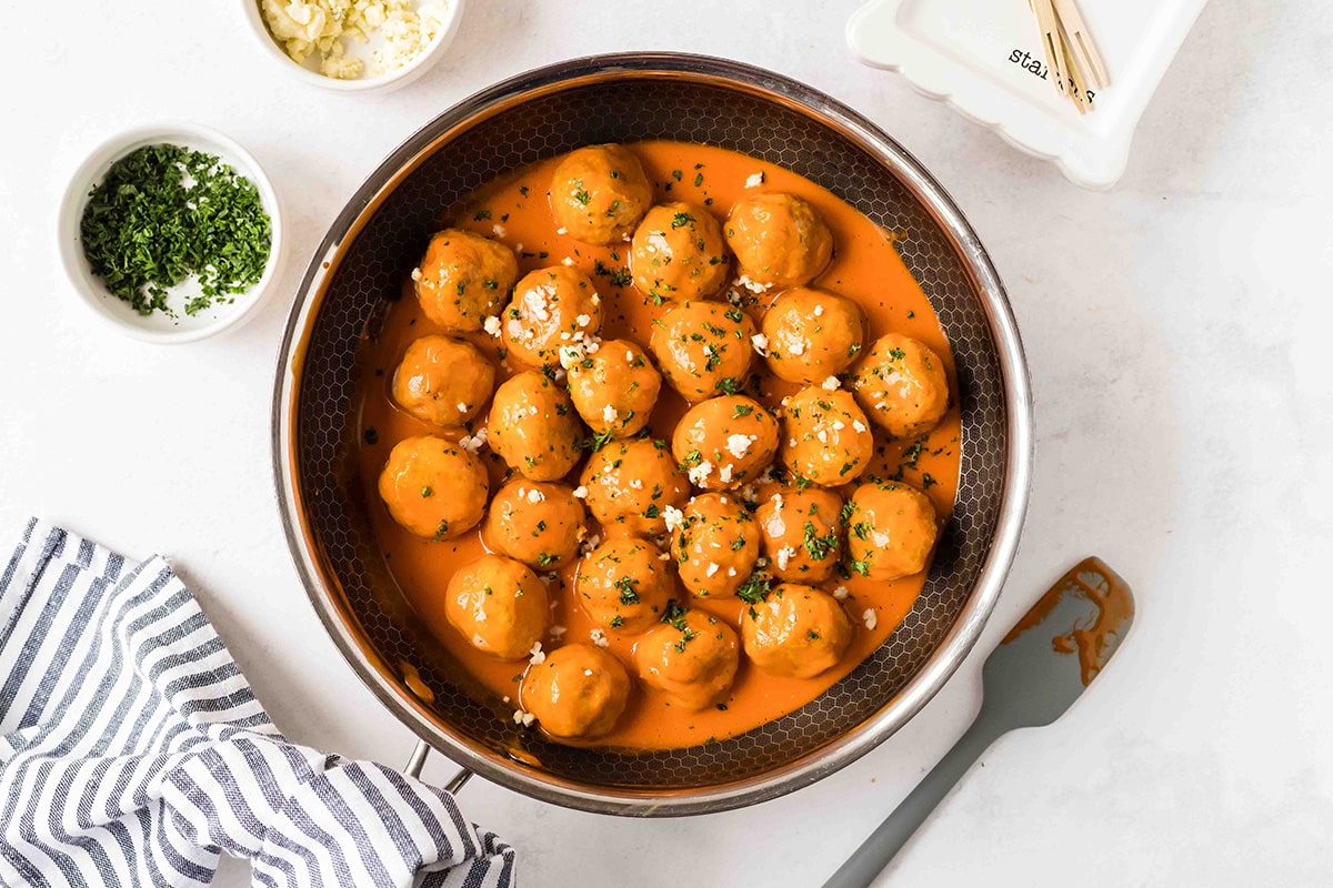 overhead shot of buffalo chicken meatballs in a pan