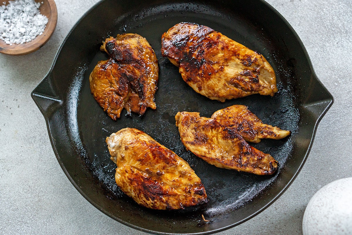 chicken cooking in pan