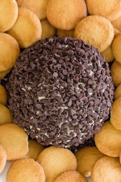 A close up of cookie dough cheese ball with nilla wafers