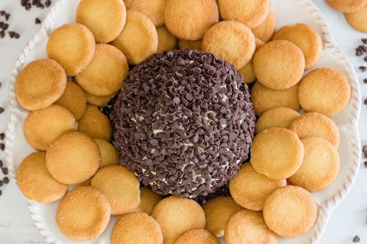 A close up of cookie dough cheese ball with nilla wafers