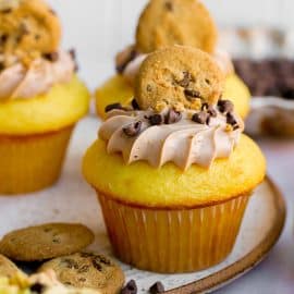 straight on shot of cupcake topped with chocolate chip cookie