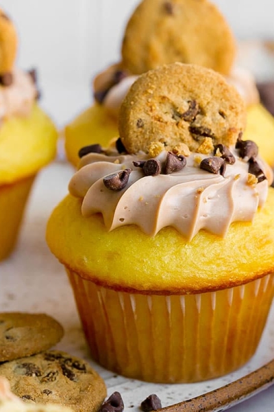 straight on shot of cupcake topped with chocolate chip cookie