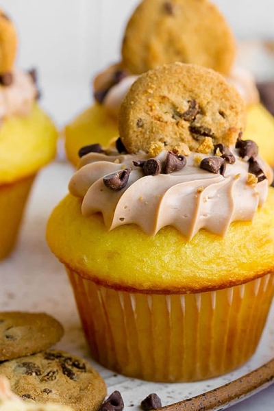 straight on shot of cupcake topped with chocolate chip cookie