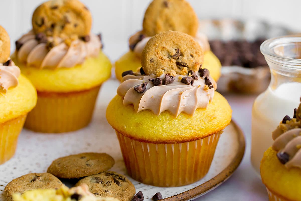 straight on shot of cupcake topped with chocolate chip cookie