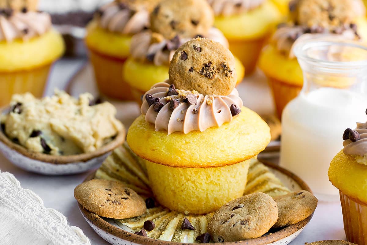 straight on shot of stuffed cookie dough cupcake on a plate