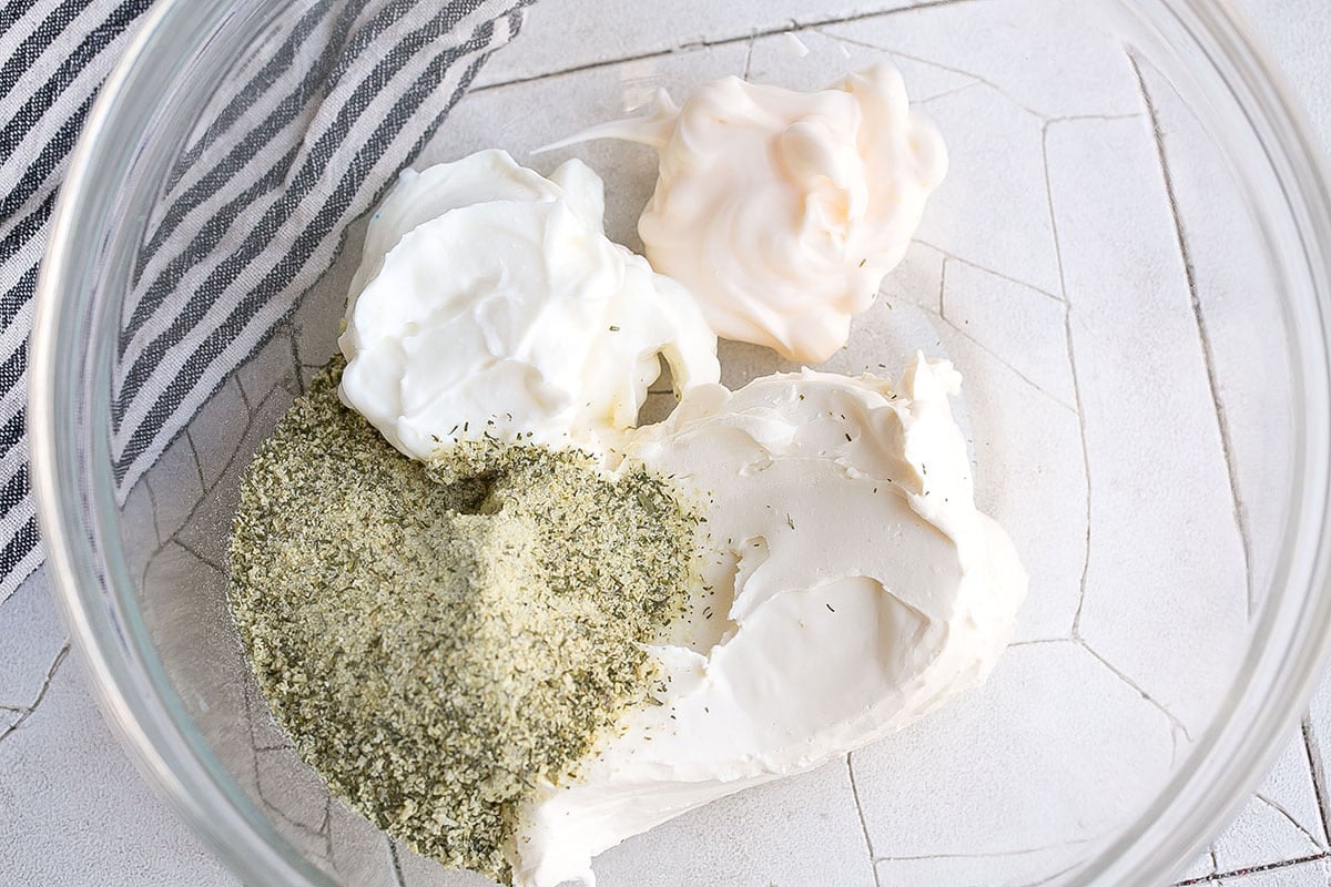 mayo, sour cream, cream cheese and seasonings in a bowl- how to make crack dip
