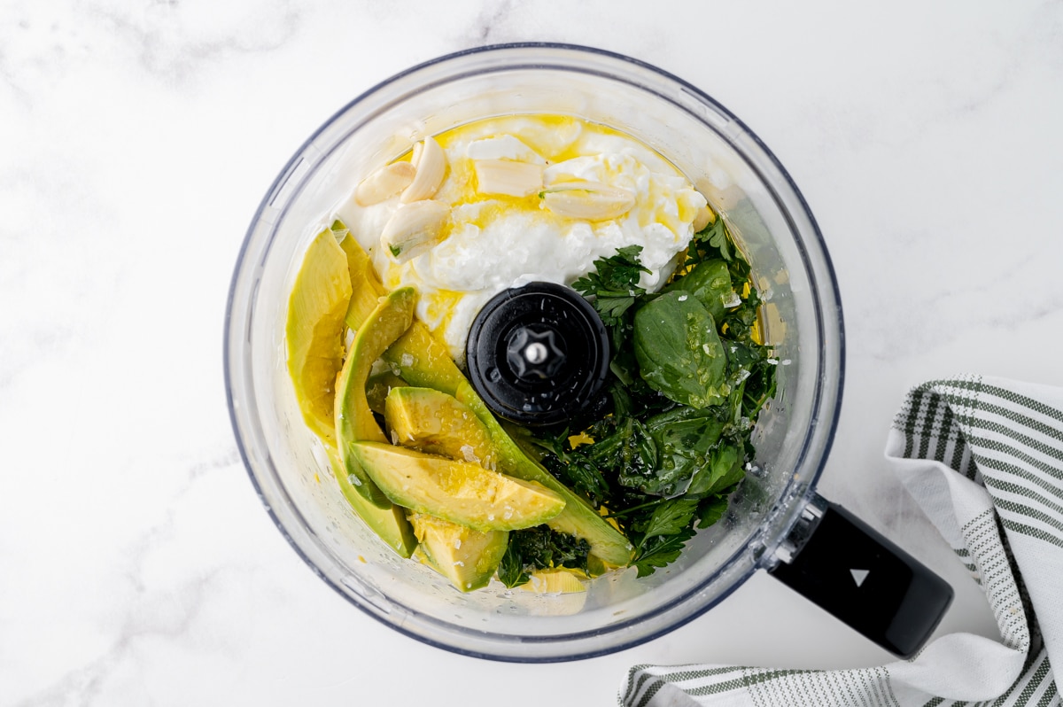 creamy avocado pasta sauce ingredients in a food processor