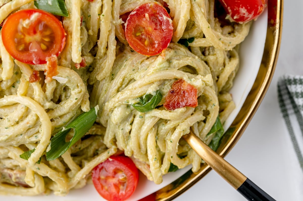 twirl of creamy avocado pasta on a fork