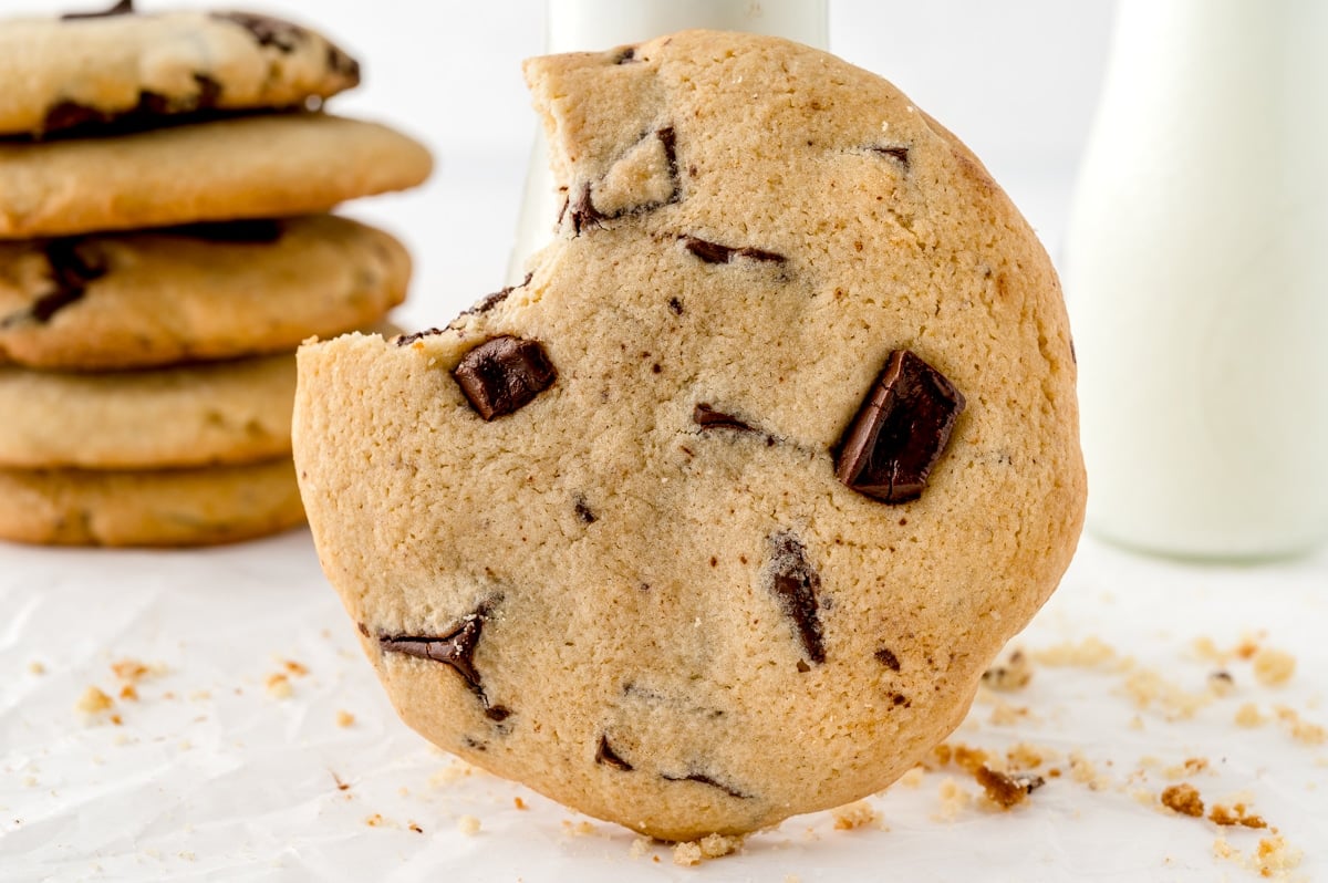 cookie standing up with a bite out of it.