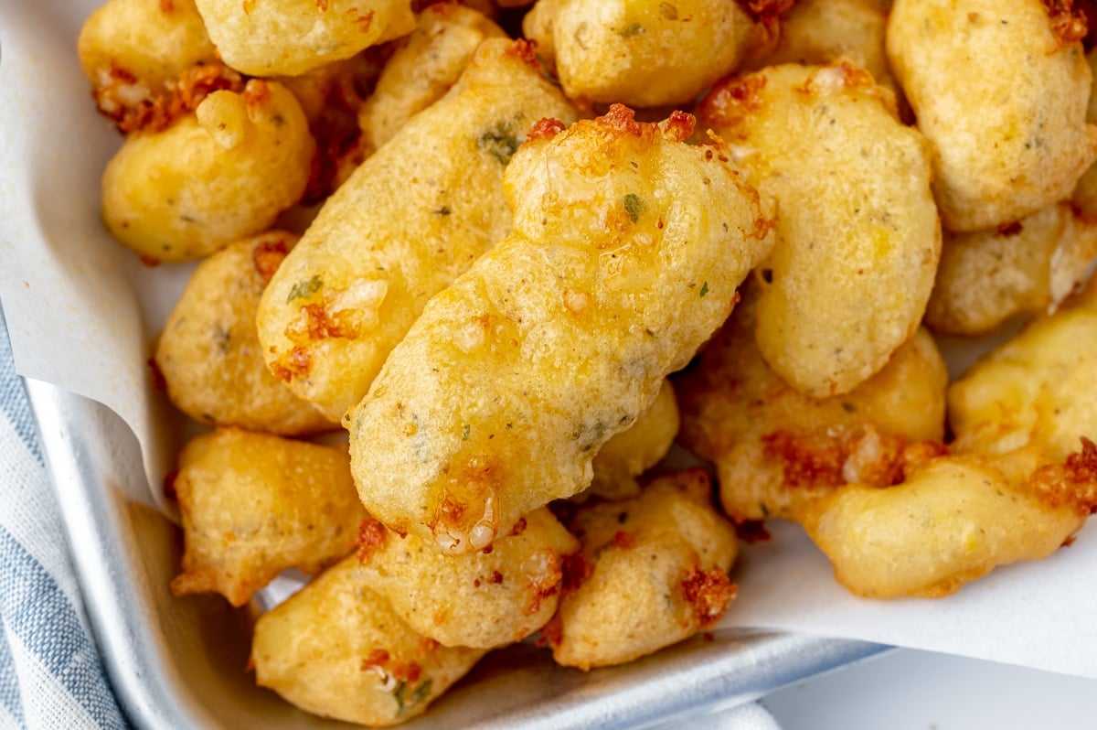 close up of cheese curds on a tray