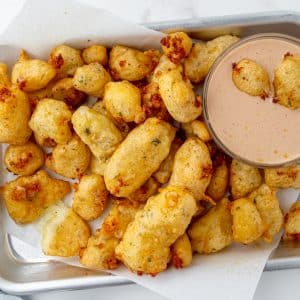 tray of fried cheese curds with dipping sauce
