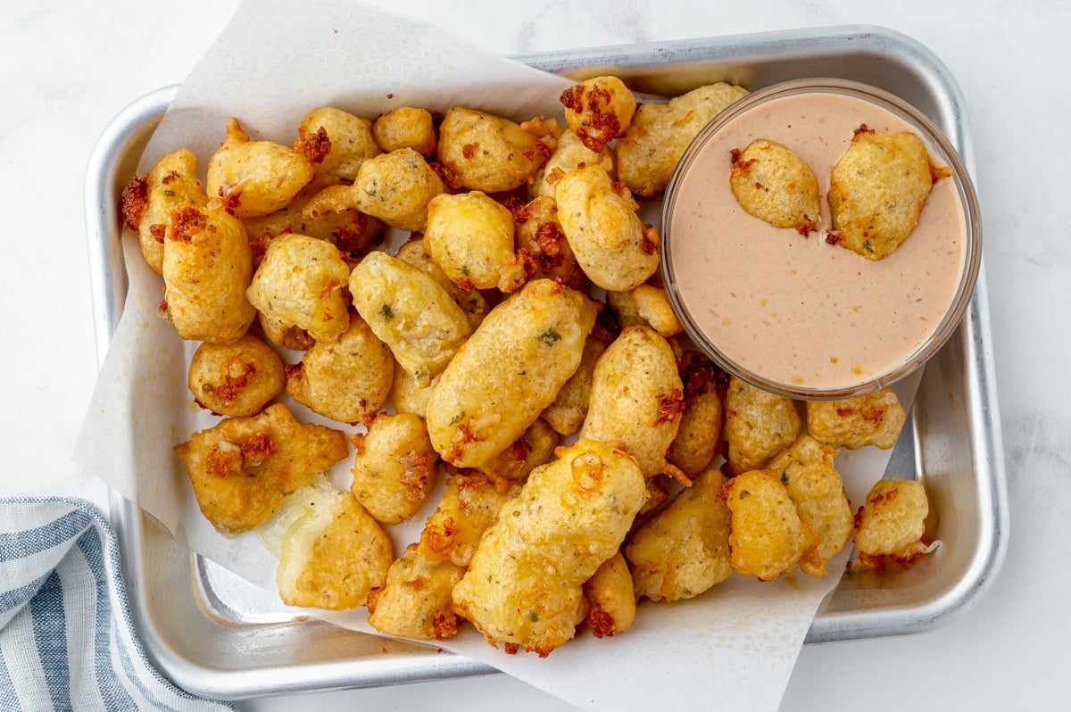 tray of fried cheese curds with dipping sauce