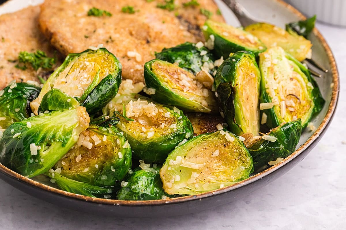 close up of parmesan brussels sprouts on a plate