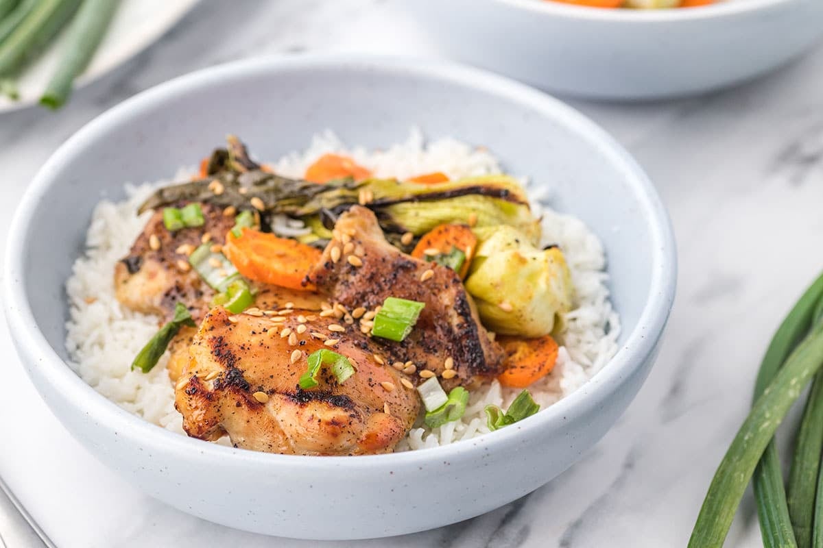 chicken and veggies in bowl with rice