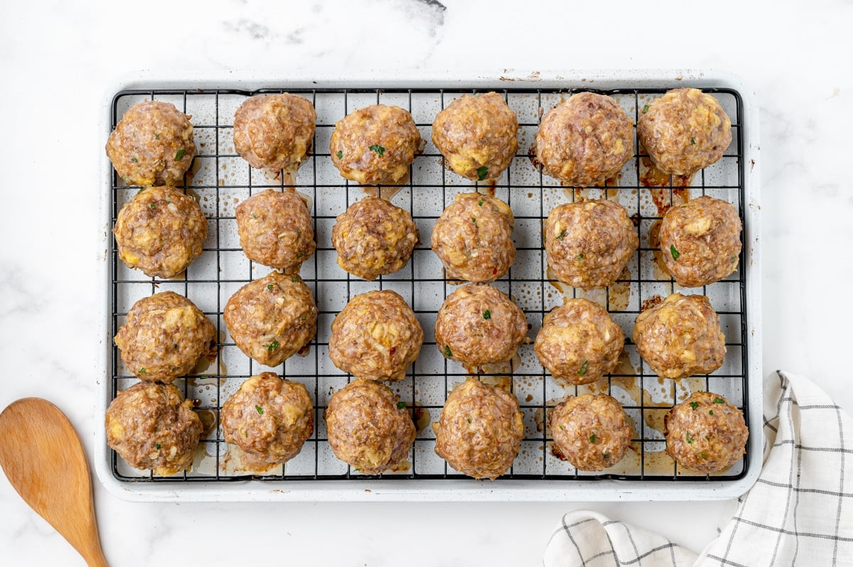 cooked meatballs on a baking sheet