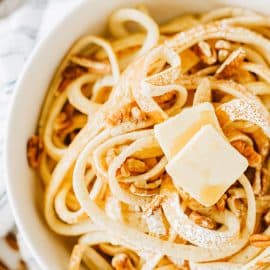 close up of butter on breakfast spaghetti in a bowl