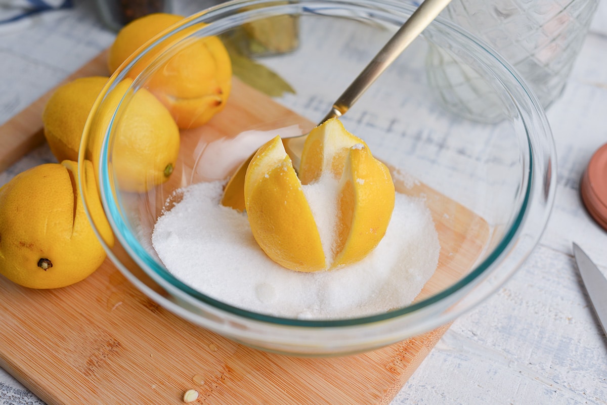 salt and sugar spooned onto cut lemon