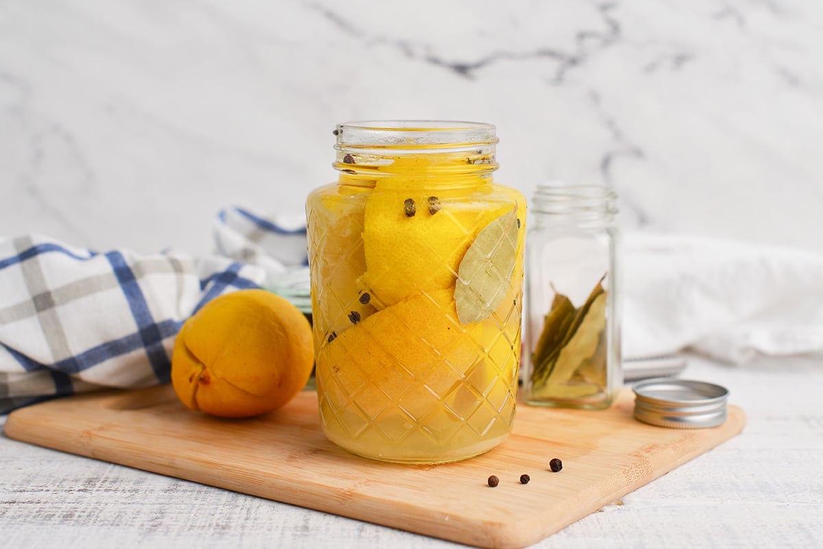straight on shot of jar of preserved lemons