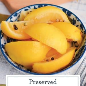 angled shot of preserved lemons in a blue bowl with text overlay for pinterest