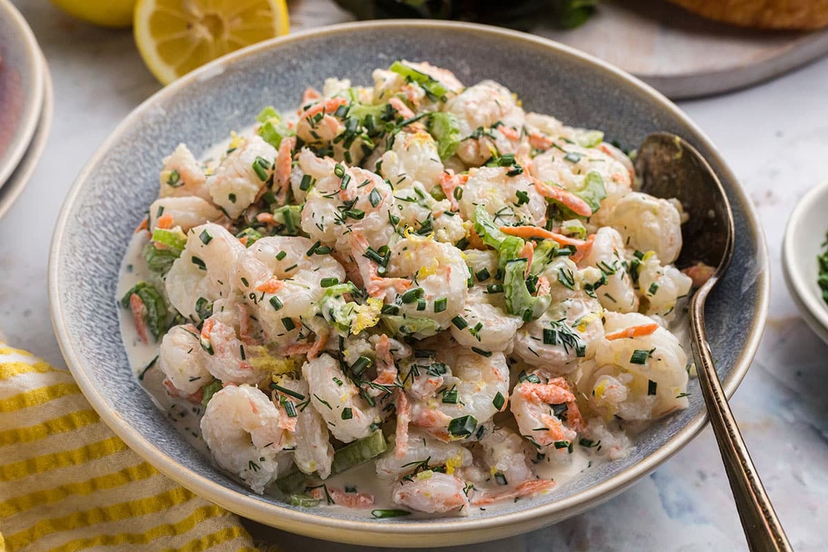 angled shot of bowl of lemon garlic shrimp salad