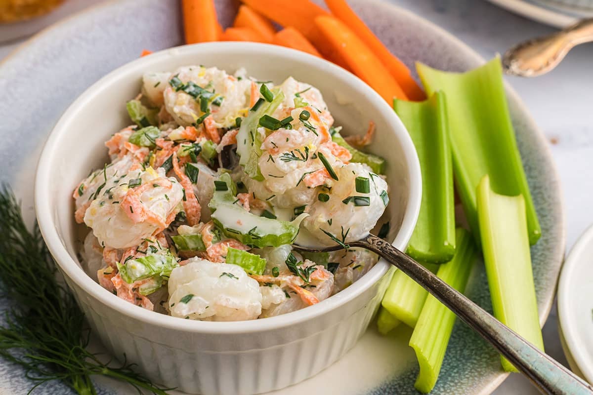 spoon in bowl of shrimp salad