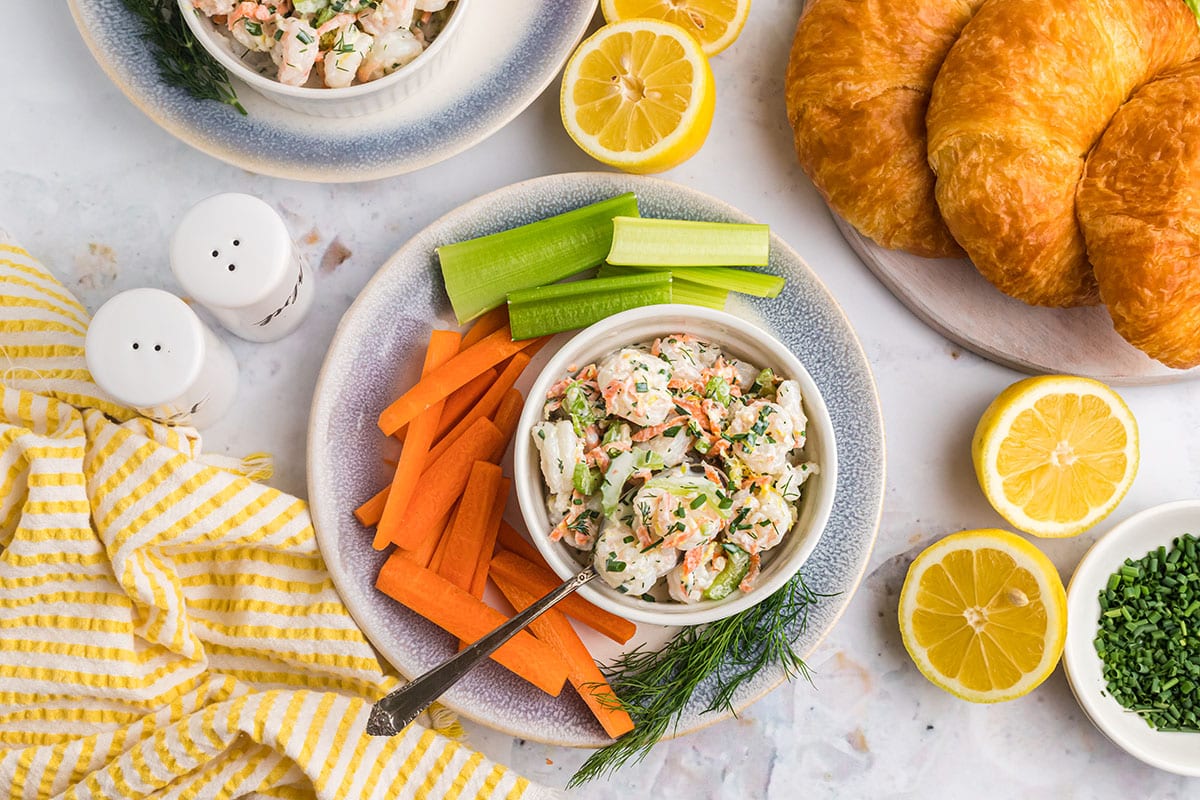 bowl of shrimp salad with carrots and celery